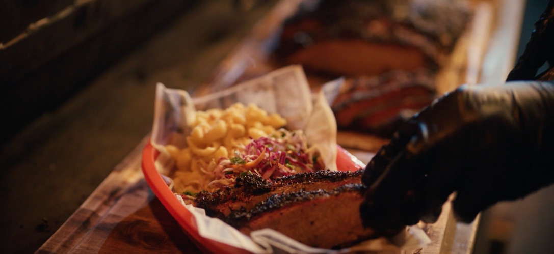 example image of brisket being plated from Monster and Bear's TVC content production created for The St Food Co